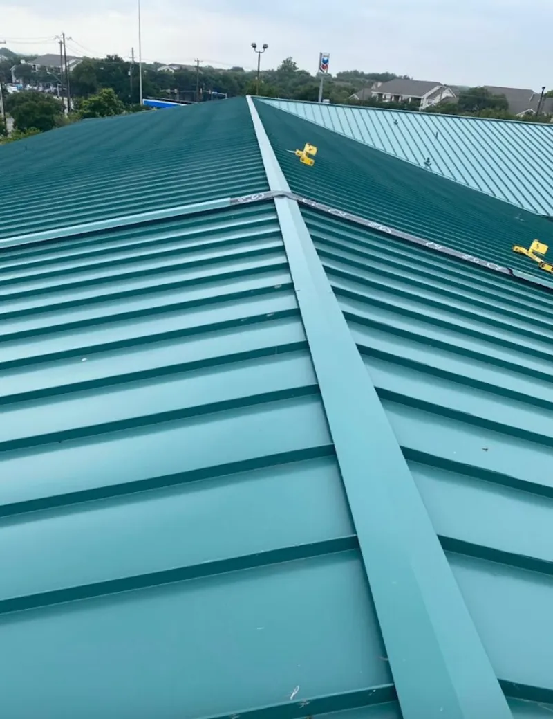 Green commercial metal roof ridge and valley for Metal Roof Repair in Westwood